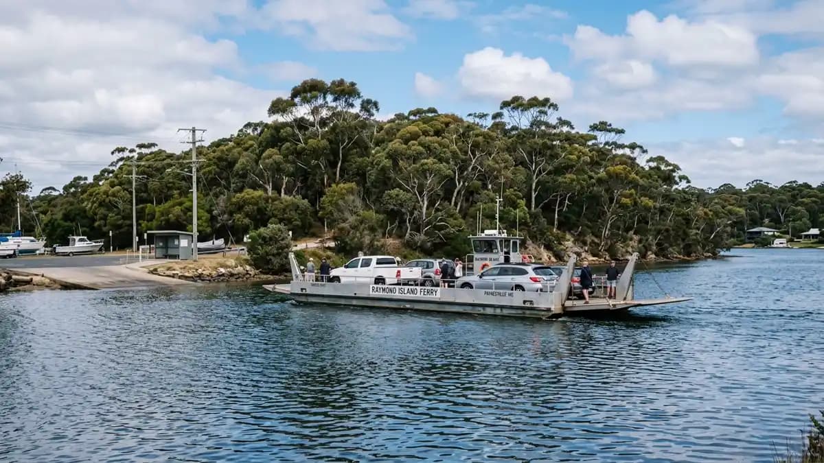 Paynesville foreshore on the Gippsland Lakes with boats and Raymond Island ferry, Victoria