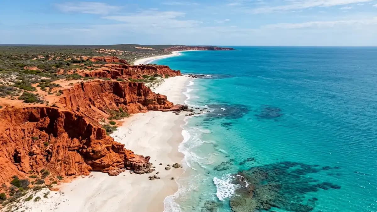 Red pindan cliffs meeting turquoise Indian Ocean at Cape Leveque, Dampier Peninsula Western Australia