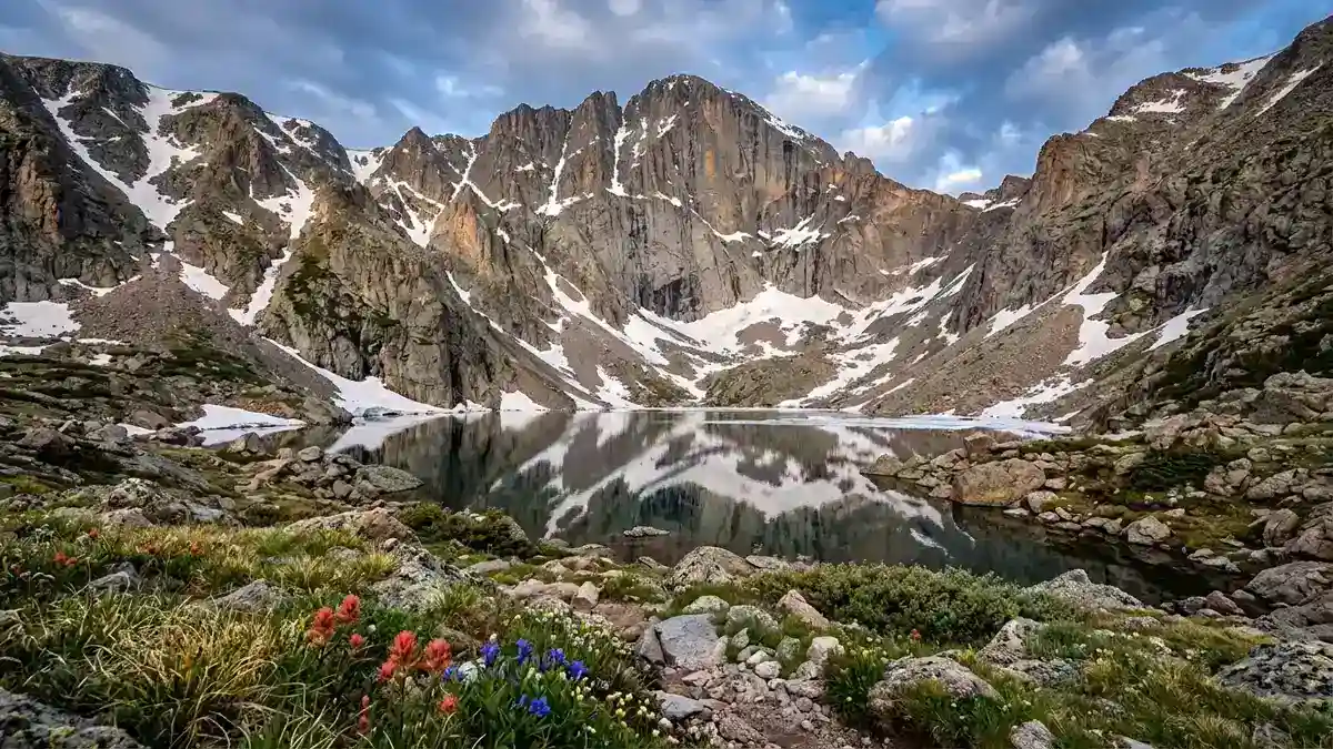 Chasm Lake in glacial cirque beneath the 900-foot Diamond vertical east face of Longs Peak in Rocky Mountain National Park