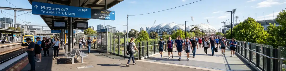 Richmond Station platform with pedestrians heading toward AAMI Park along the Melbourne sports precinct walkway