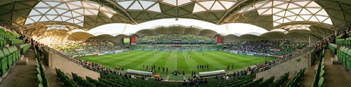 View inside AAMI Park looking across the rectangular pitch with the bioframe geodesic roof overhead