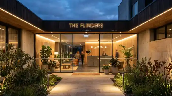 Modern hotel entrance at dusk near Sydney Olympic Park