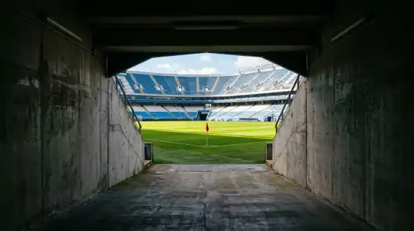 View from inside the Accor Stadium players tunnel looking out onto the green pitch