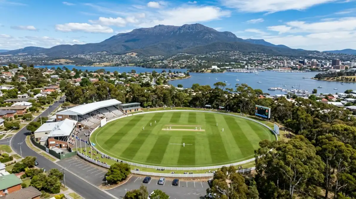 Aerial view of Blundstone Arena cricket ground with kunanyi Mount Wellington dominating the skyline behind