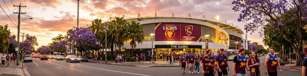 The Gabba Brisbane at golden hour viewed from Vulture Street with fans walking toward the entrance