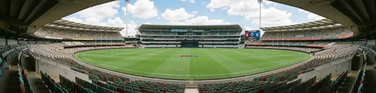 Inside The Gabba Brisbane looking across the playing field from the Western Stand with empty green oval and AFL markings