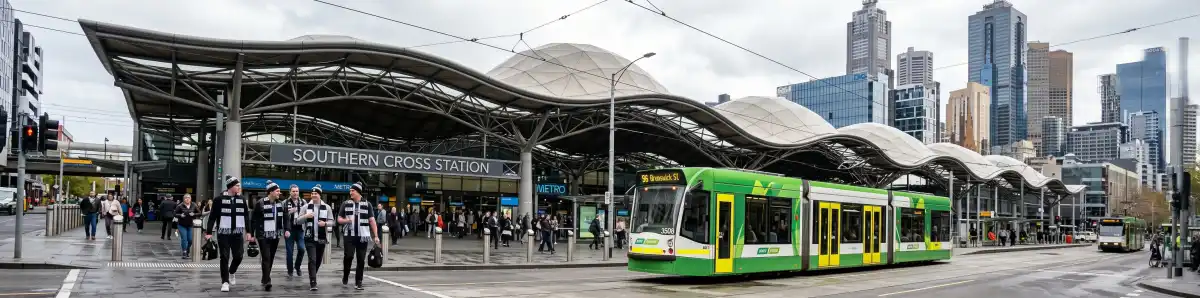 Southern Cross Station Melbourne exterior with its distinctive undulating roof, trams and pedestrians in the foreground