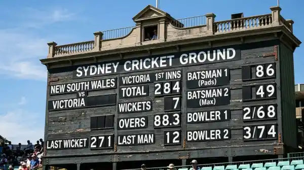 Close-up of the historic SCG scoreboard with cricket statistics and numbers displayed